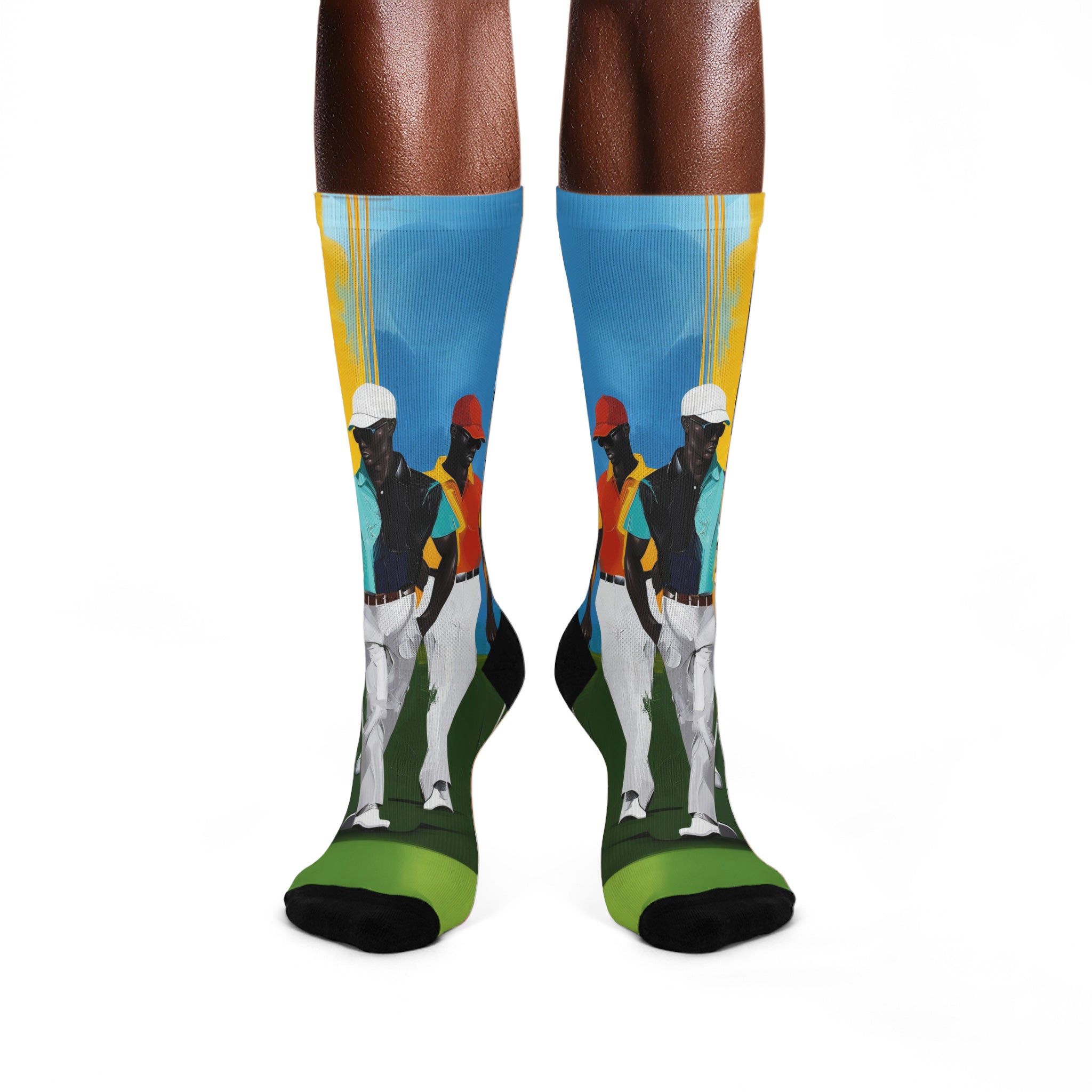 White crew socks featuring Afrocentric painterly artwork of Black men playing golf on a vibrant green course, celebrating Black joy, leisure, and stylish golf culture.