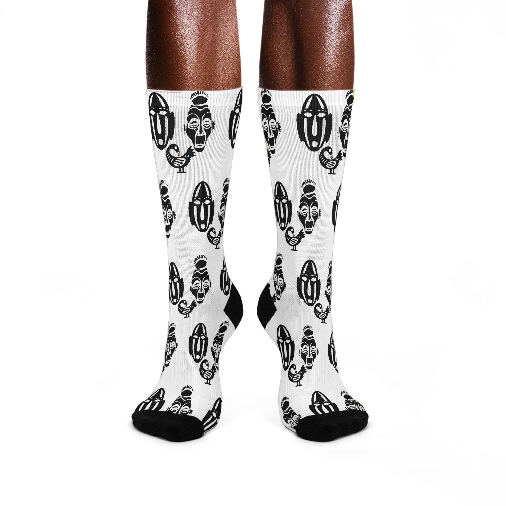 White crew socks featuring the Sankofa Adinkra bird symbol and two traditional African masks representing African heritage, cultural pride, and the meaning “Go Back and Get It.”
