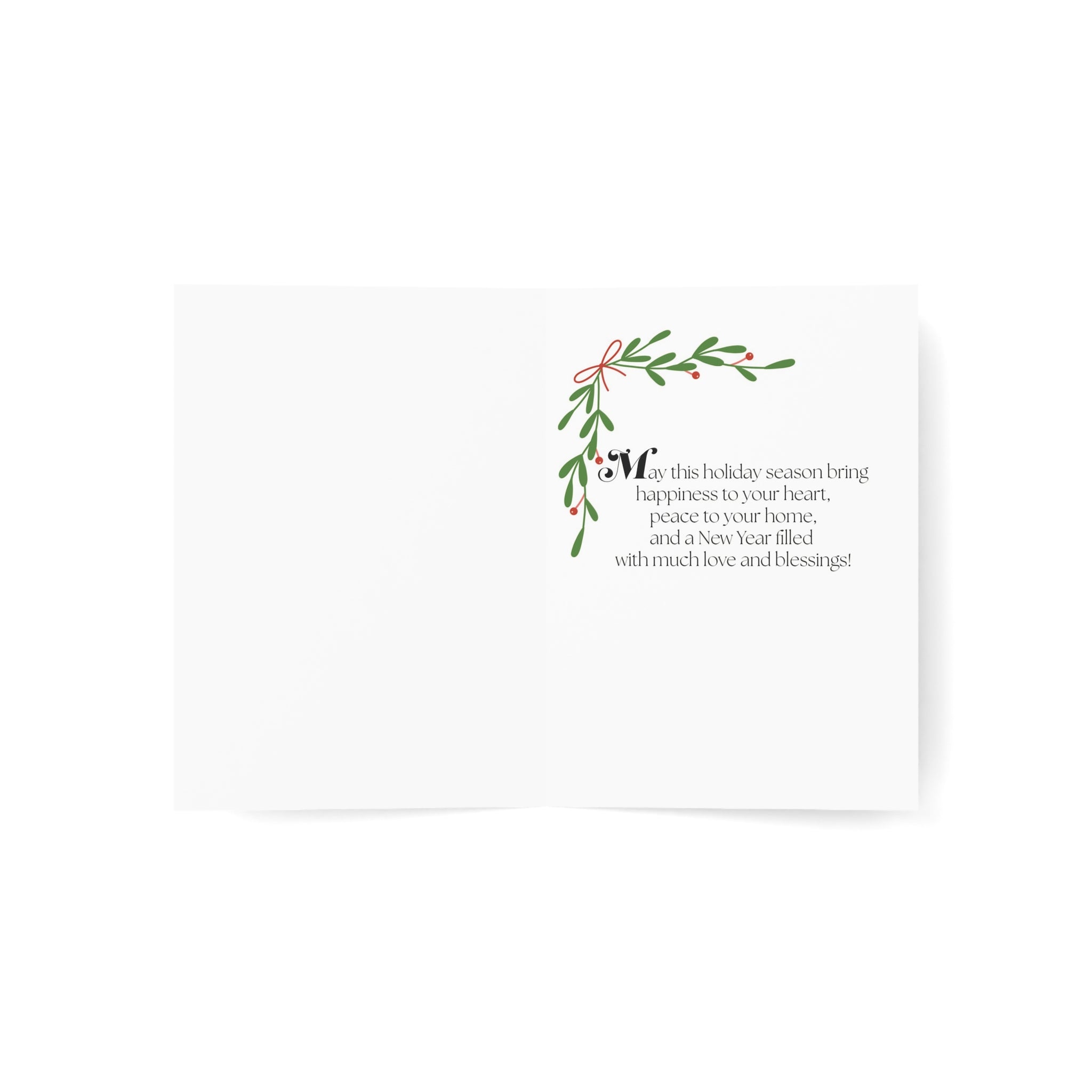 A white greeting card with a small green mistletoe illustration and black printed holiday message, shown on a clean white background.