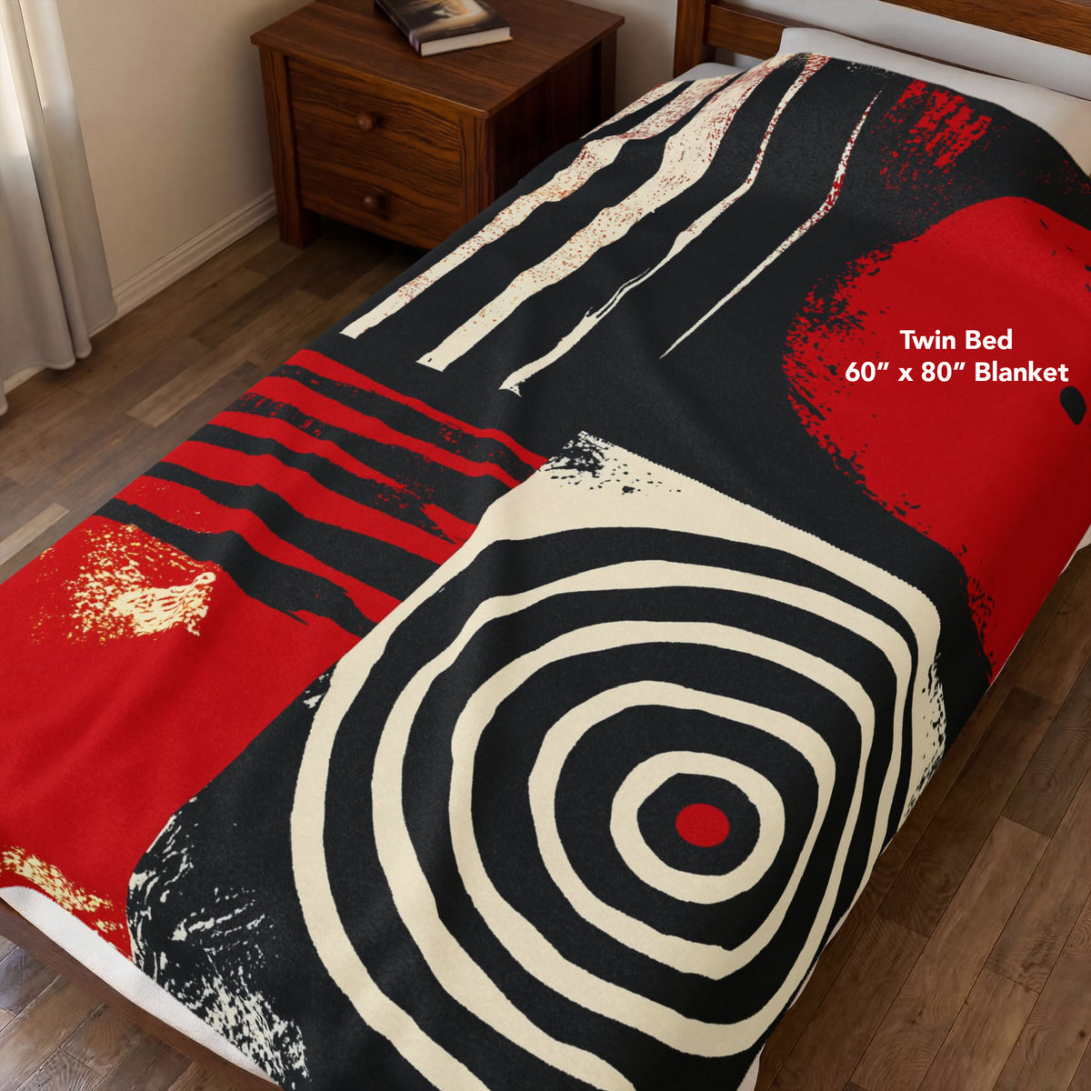 Afrocentric geometric art throw blanket featuring bold black, red, gold, cream, and neutral abstract patterns with circles, spirals, grids, and textured African-inspired geometric shapes, covering a twin size bed.