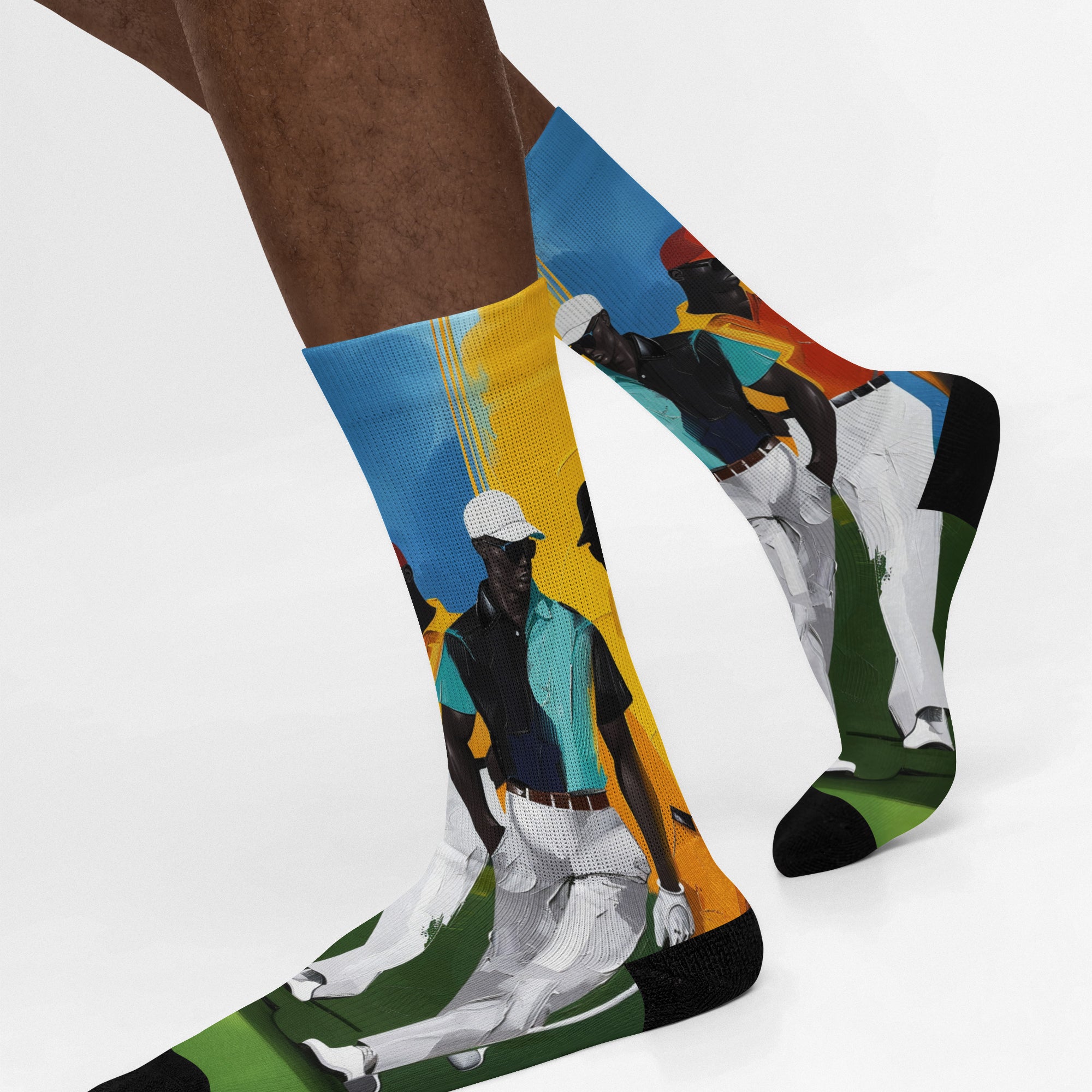 White crew socks featuring Afrocentric painterly artwork of Black men playing golf on a vibrant green course, celebrating Black joy, leisure, and stylish golf culture.