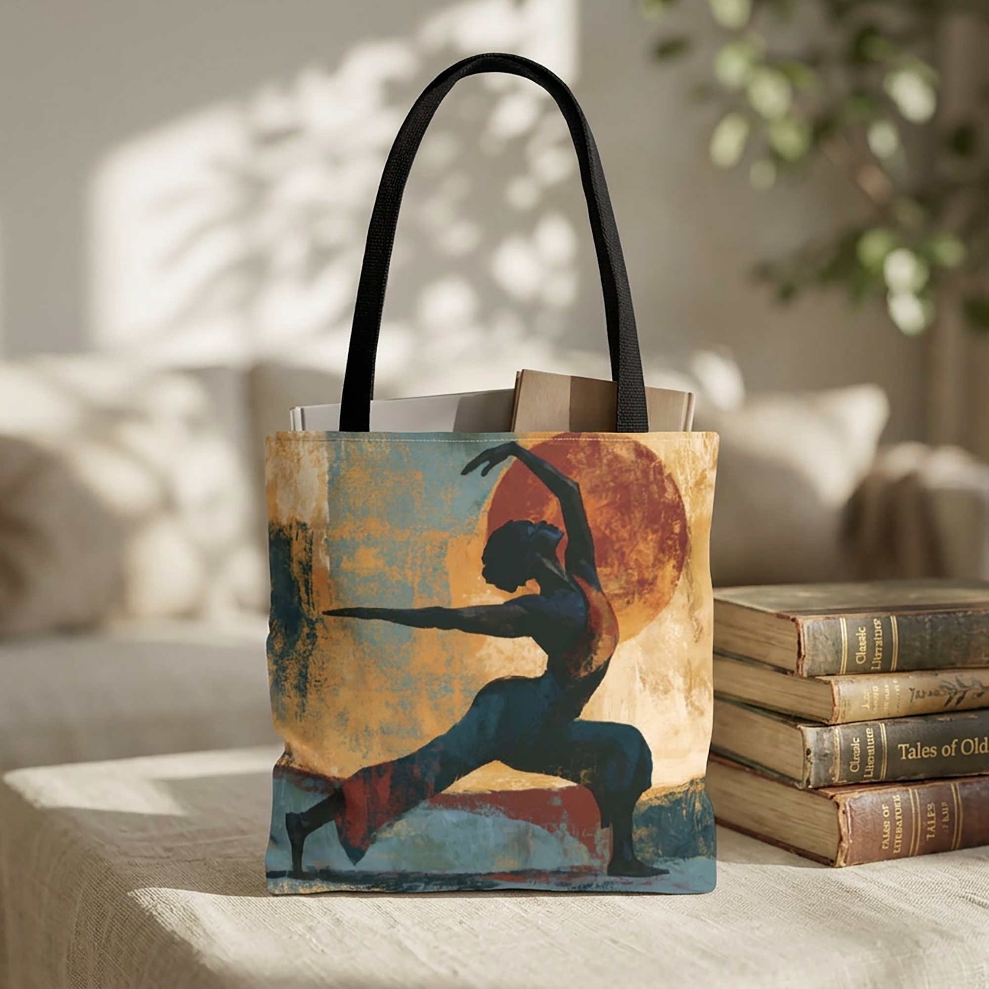 Black Woman Yoga tote bag featuring abstract textured Afrocentric artwork of an African American woman in a peaceful yoga pose, styled sitting on a table with a stack of books.