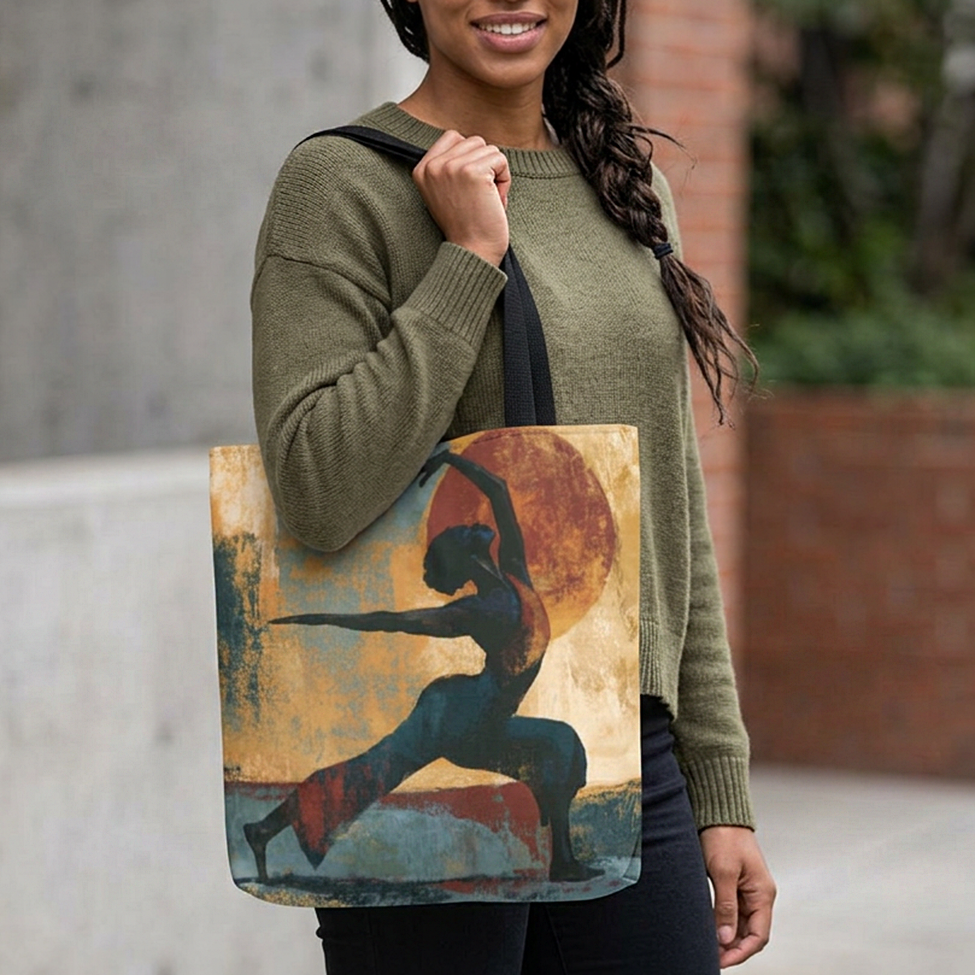 Black woman carrying the Black Woman Yoga tote bag featuring abstract textured Afrocentric artwork of an African American woman in a peaceful yoga pose.