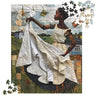 Afrocentric jigsaw puzzle featuring a Black woman hanging laundry on a clothesline, illustrated in a mosaic quilt collage style celebrating domestic life, care, and cultural heritage.