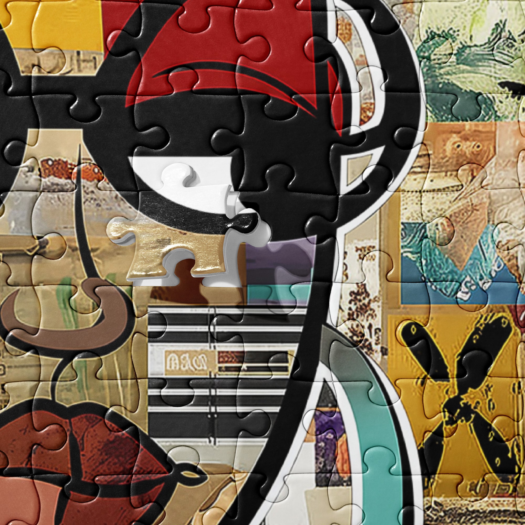 A close-up of a completed jigsaw puzzle featuring a stylized collage of abstract and scenic artwork, including a large black-and-red curved shape, striped details, and a yellow section with a black cross-like motif.