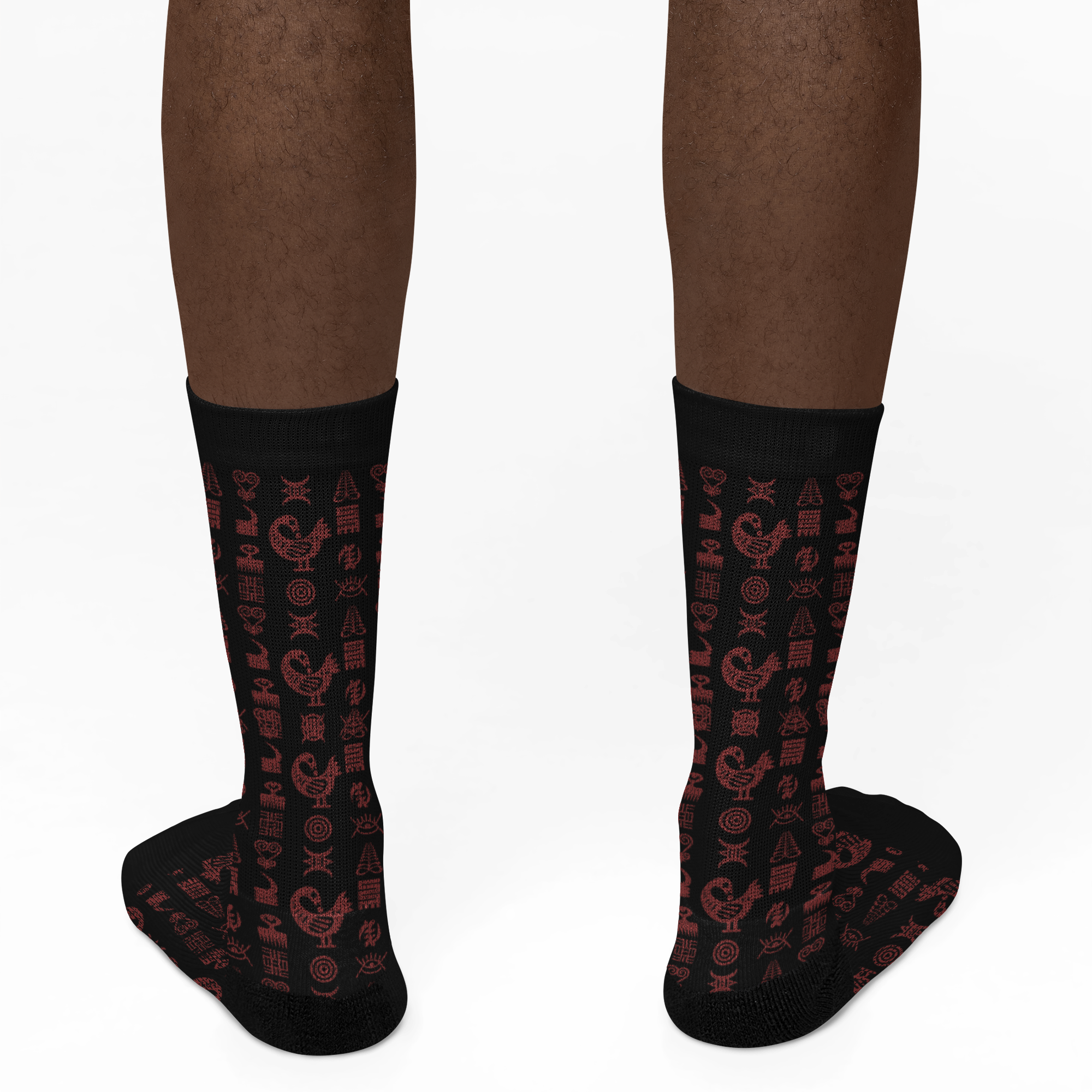 Crew socks featuring traditional Ghanaian Adinkra symbols in an Afrocentric pattern representing wisdom, strength, unity, perseverance, and African cultural heritage.