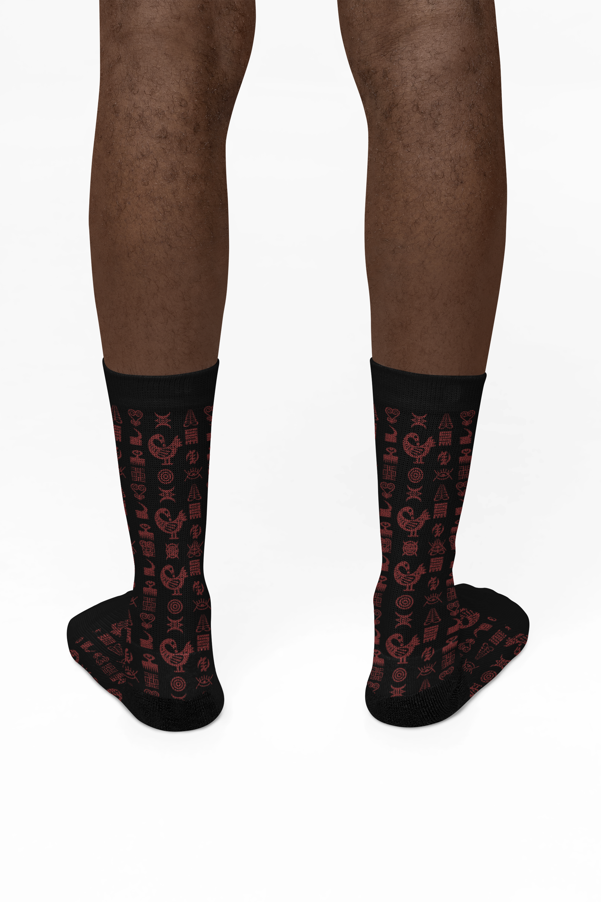 Crew socks featuring traditional Ghanaian Adinkra symbols in an Afrocentric pattern representing wisdom, strength, unity, perseverance, and African cultural heritage.