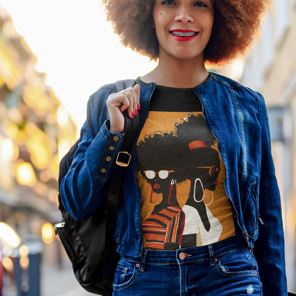 Two Black Women silhouette wearing fashionable eyewear on an orange background, featured on an Afrocentric unisex tee shirt
