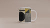 Video of the Afrocentric geometric coffee mug featuring bold black, mustard gold, cream and red abstract shapes, arches, stripes and checkerboard patterns.