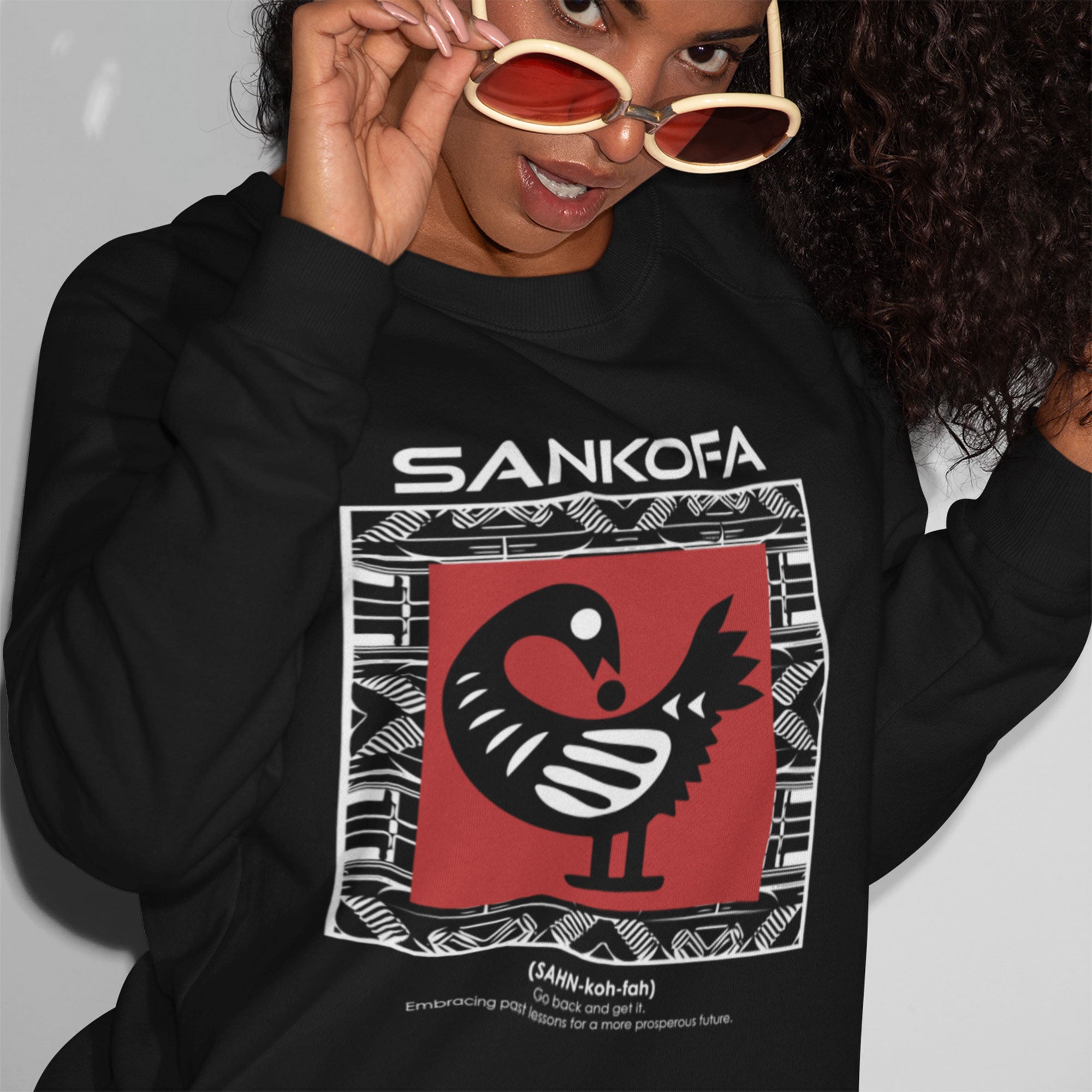Adinkra Sankofa Sweatshirt with Ghana’s iconic bird symbol and cultural definition. Afrocentric unisex pullover celebrating African heritage, history, and Black pride.