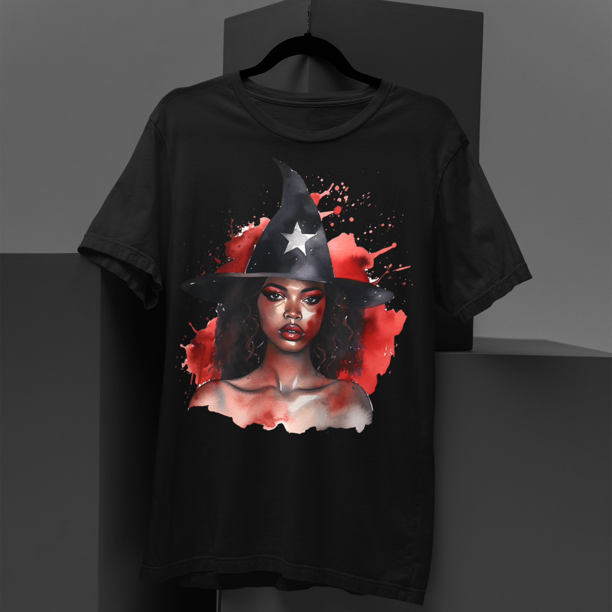 Black Witch Tee Shirt featuring an Afrocentric illustration of a beautiful African American witch in Halloween style, unisex graphic tee for Afrocentric fashion and spooky season streetwear.