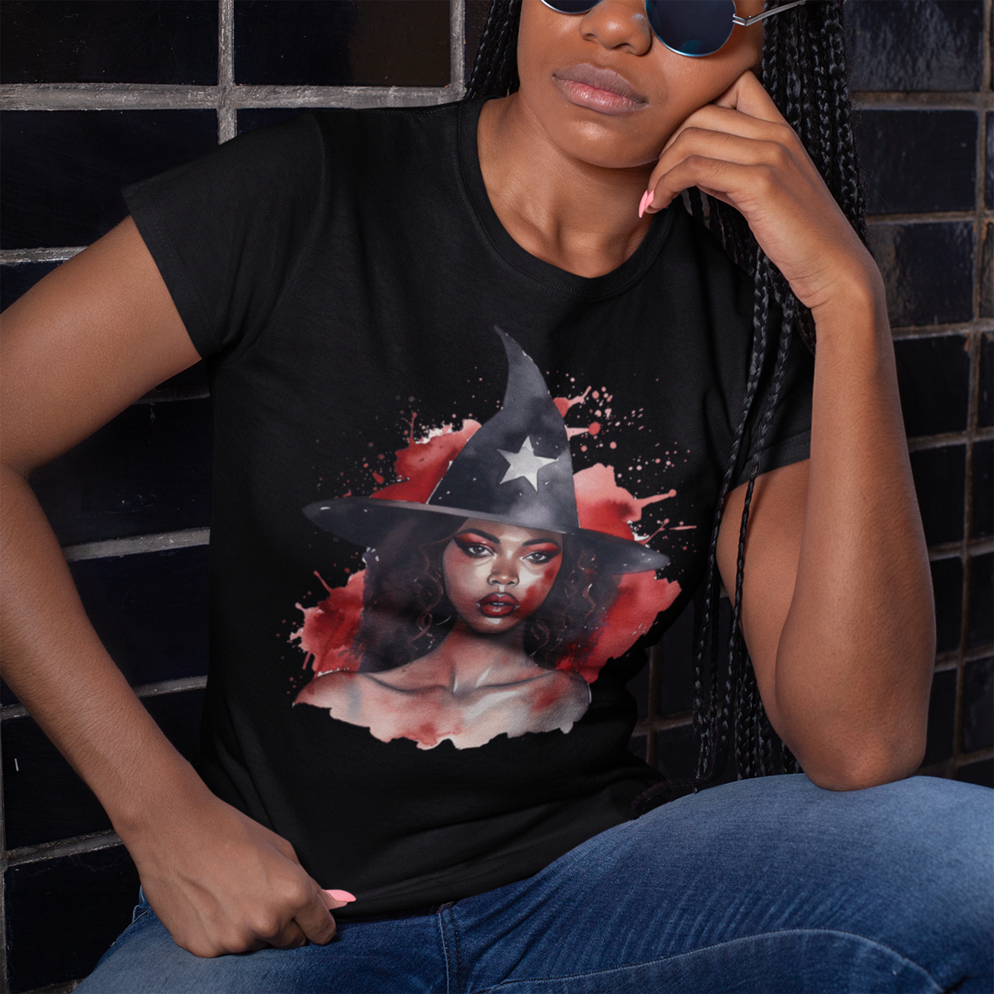 Black Witch Tee Shirt featuring an Afrocentric illustration of a beautiful African American witch in Halloween style, unisex graphic tee for Afrocentric fashion and spooky season streetwear.