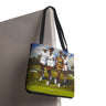 Afrocentric canvas tote bag featuring stylish Black women playing golf on a lush green golf course, celebrating leisure, sisterhood, strength, and team spirit.