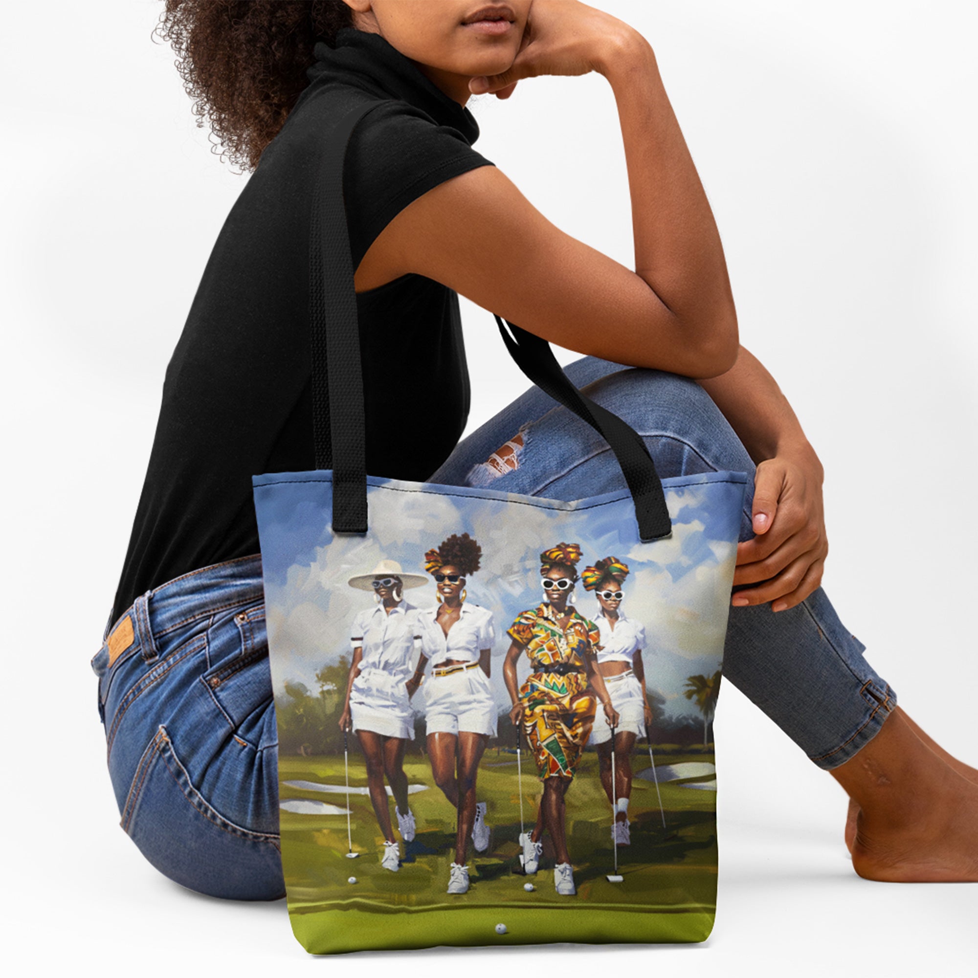 Afrocentric canvas tote bag featuring stylish Black women playing golf on a lush green golf course, celebrating leisure, sisterhood, strength, and team spirit.