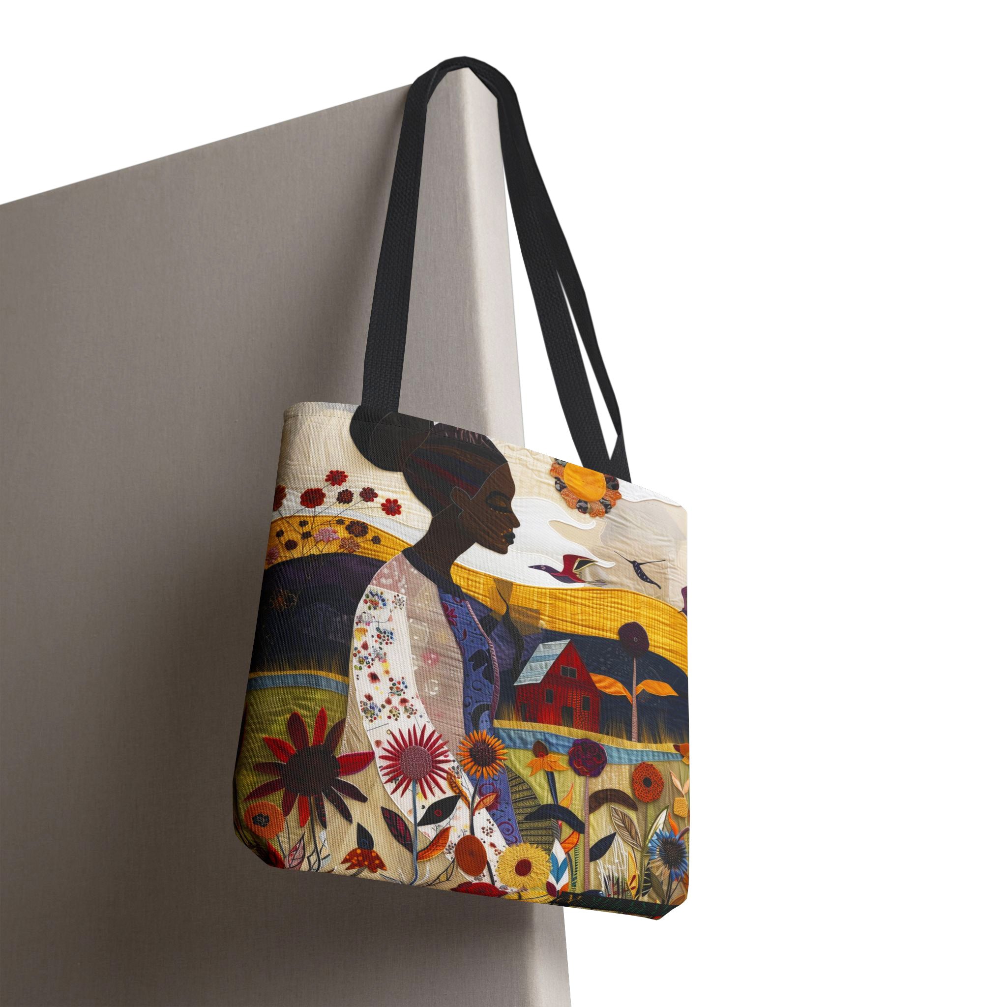 Black Woman Garden Oasis Tote Bag featuring a vibrant floral nature scene with a serene garden landscape. Afrocentric design in a faux quilt style, ideal as a shopping, book, or everyday carry-all bag.