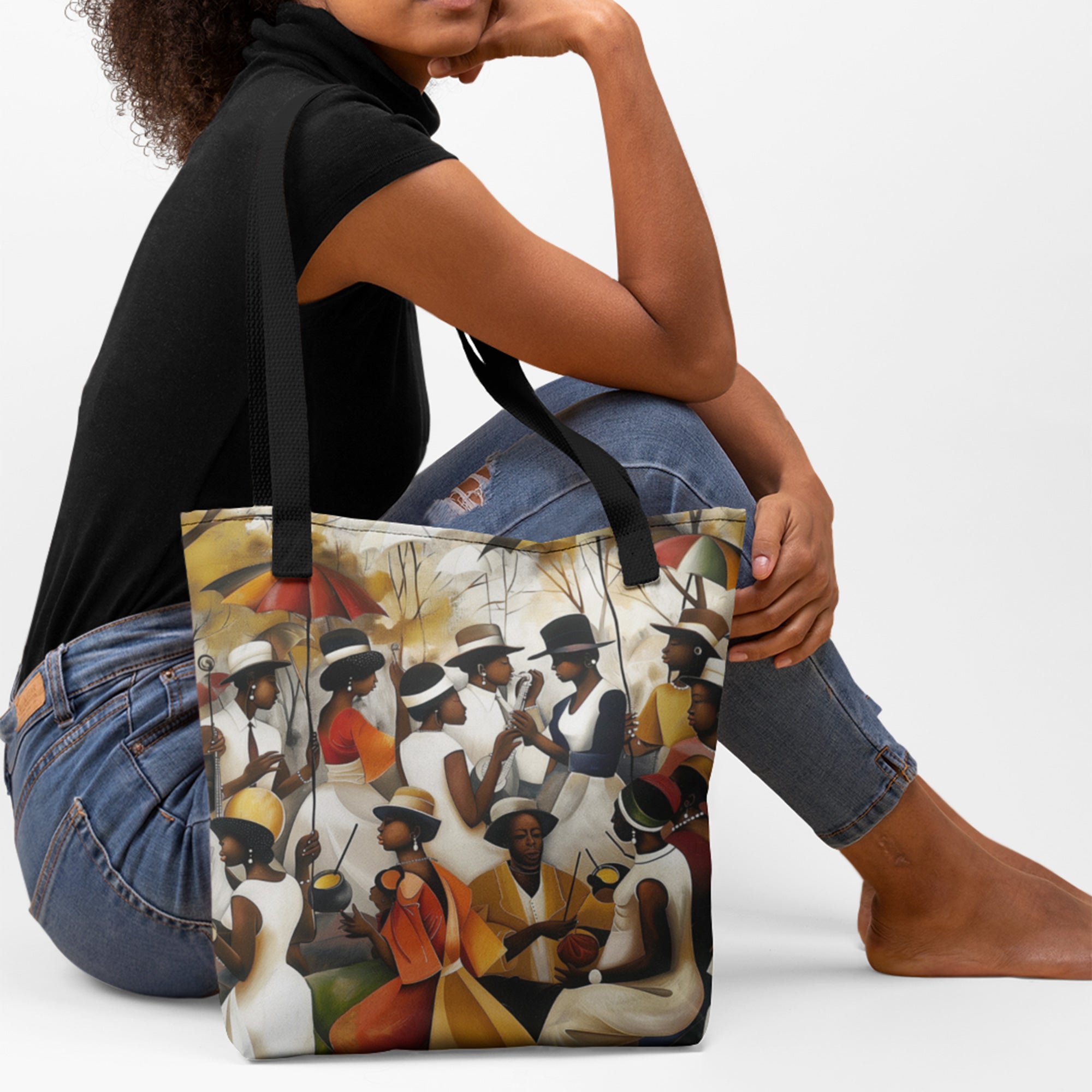 Afrocentric Juneteenth tote bag featuring a joyful Picnic in the Park family reunion celebration with African American community gathering artwork in a colorful urban artistic style.