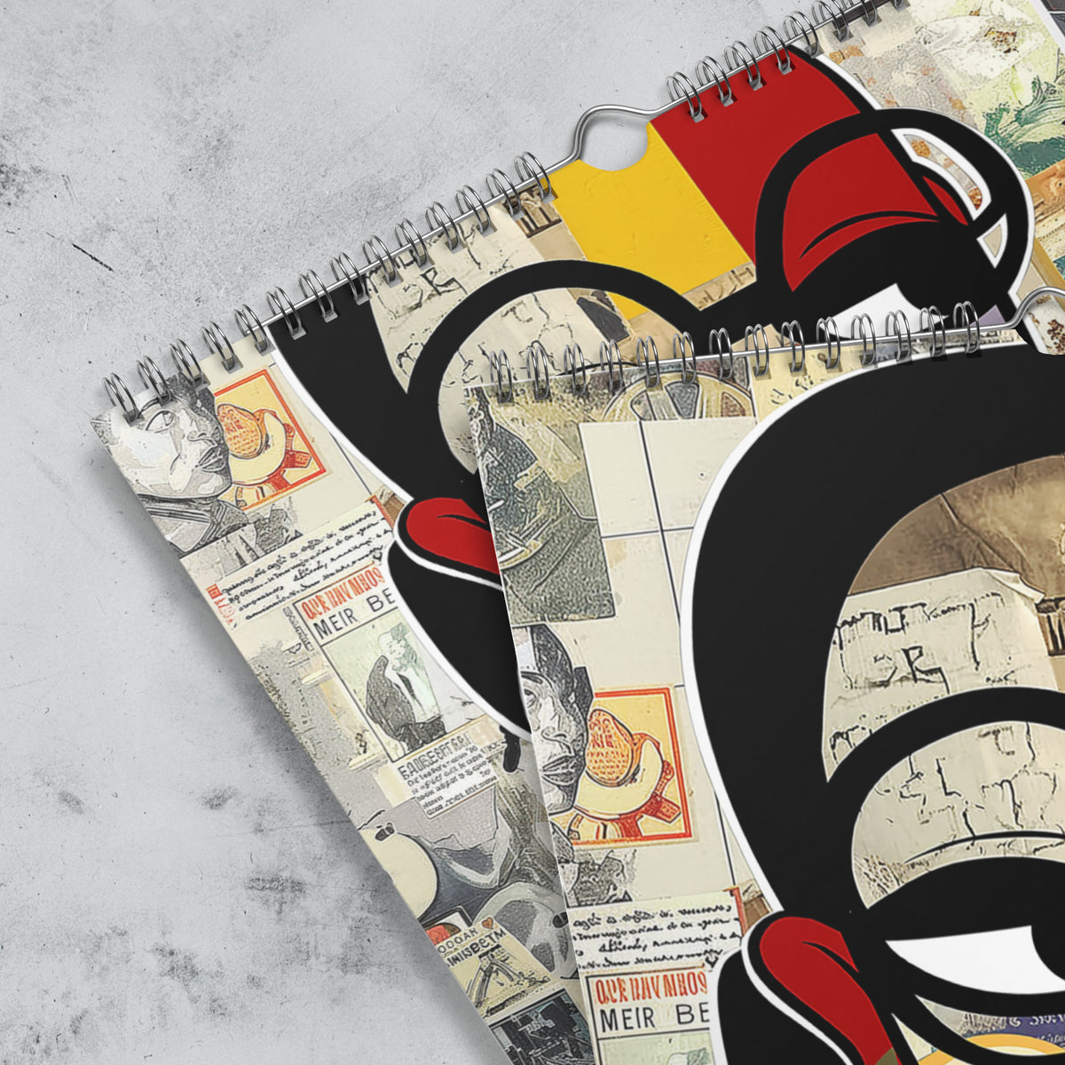 Close up detail views featuring the silver wire grommet hanging loop of an 11" x 17" 2027 Afrocentric abstract wall calendar featuring colorful African American artwork inspired by Afrofuturism, graffiti art, urban culture, bold textures, and contemporary Black artistic expression, displayed against a grey marble background.