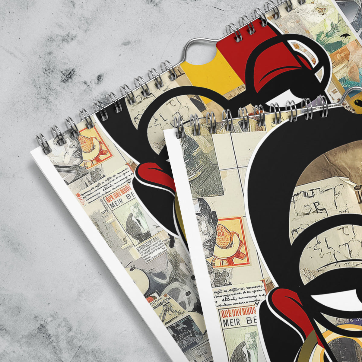 Close up detail views featuring the silver wire grommet hanging loop of an 8" x 11" 2027 Afrocentric abstract wall calendar featuring colorful African American artwork inspired by Afrofuturism, graffiti art, urban culture, bold textures, and contemporary Black artistic expression, displayed against a grey marble background.