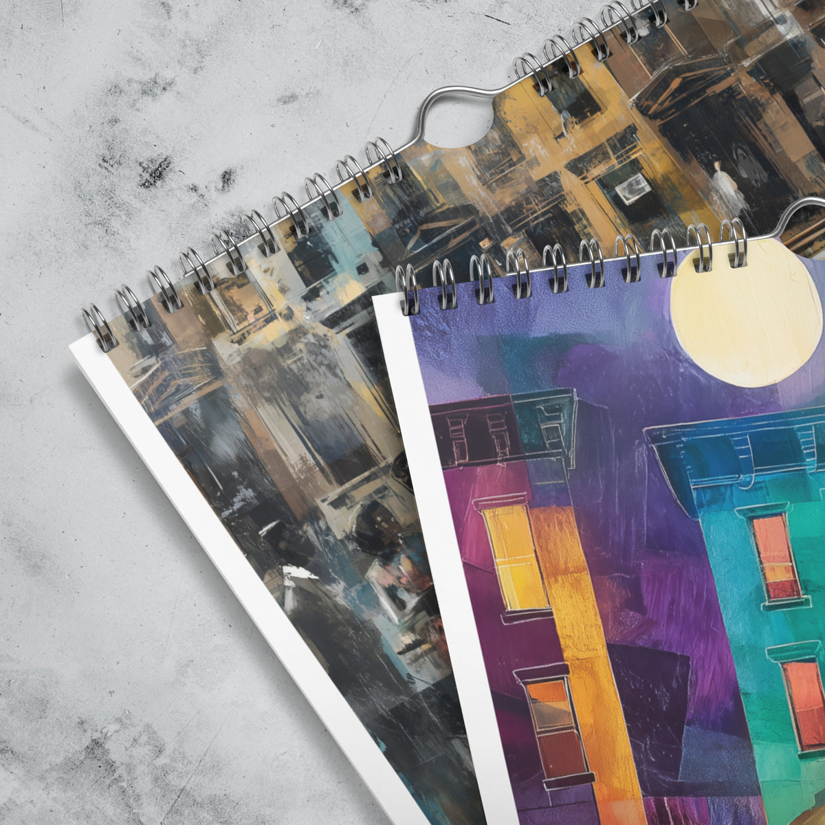 Close up detail of silver hanging wire of an 8" x 11" 2027 Harlem wall calendar featuring abstract African American art of Black people experiencing New York City street life, historic Harlem brownstones, and scenes inspired by Black culture and the Harlem Renaissance era.  Displayed against a clean white background.